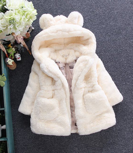 A girl's fur coat for autumn and winter