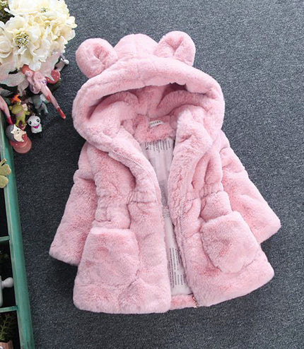 A girl's fur coat for autumn and winter